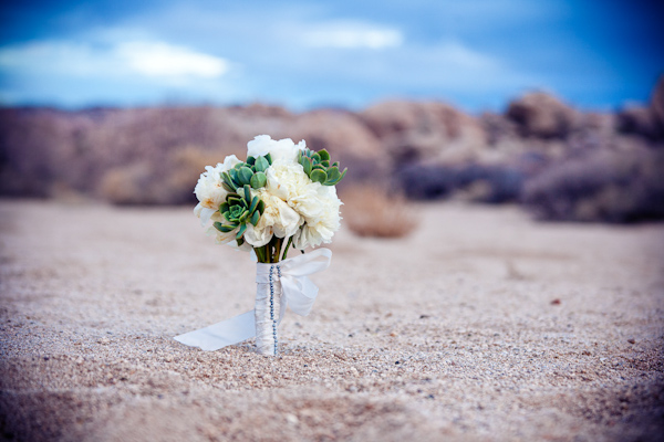 bouquet in desert sand - photo by Southern California wedding photographers Callaway Gable